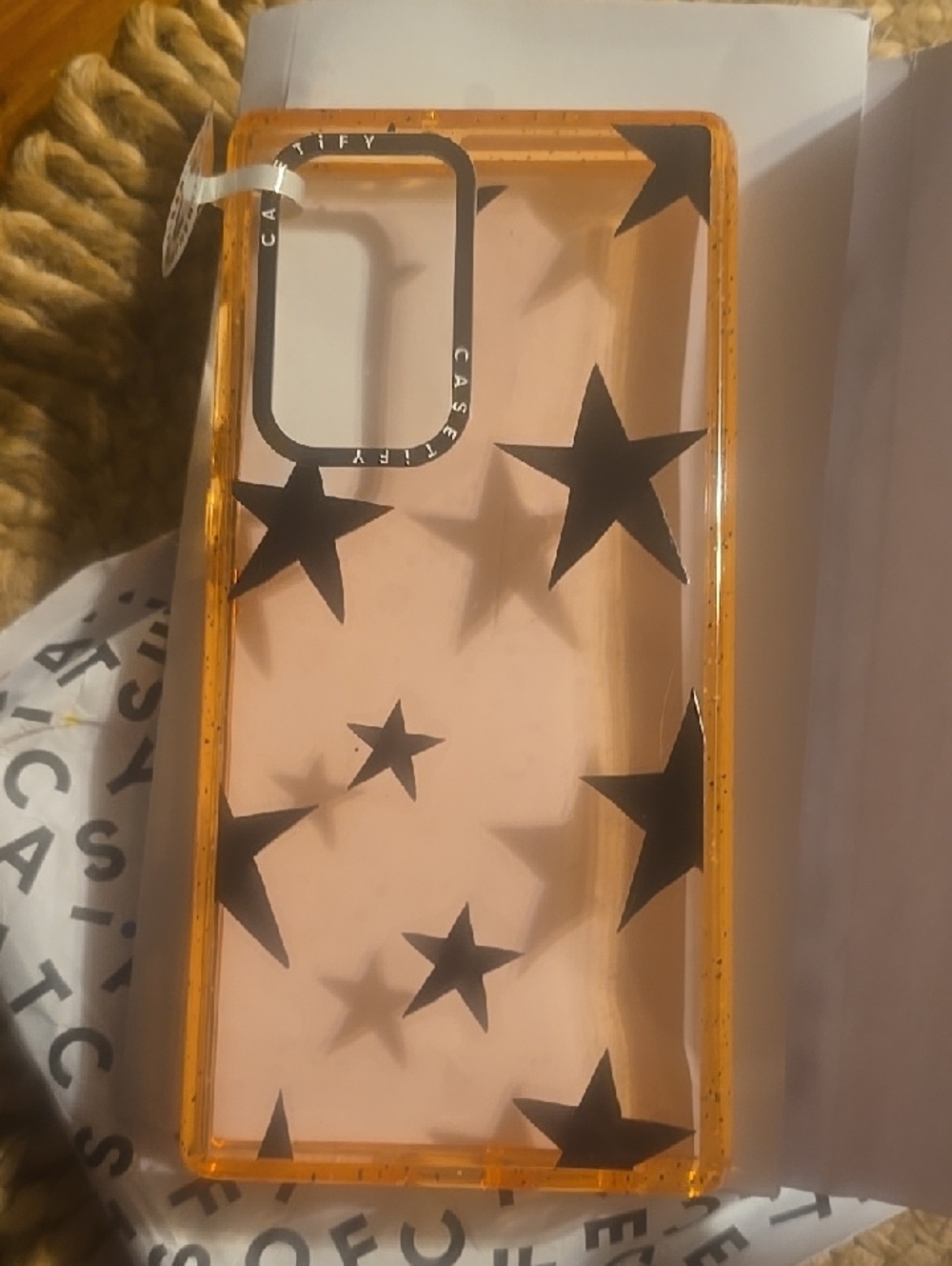 Casetify Clear Pink Case with Black Star Design and Orange Trim